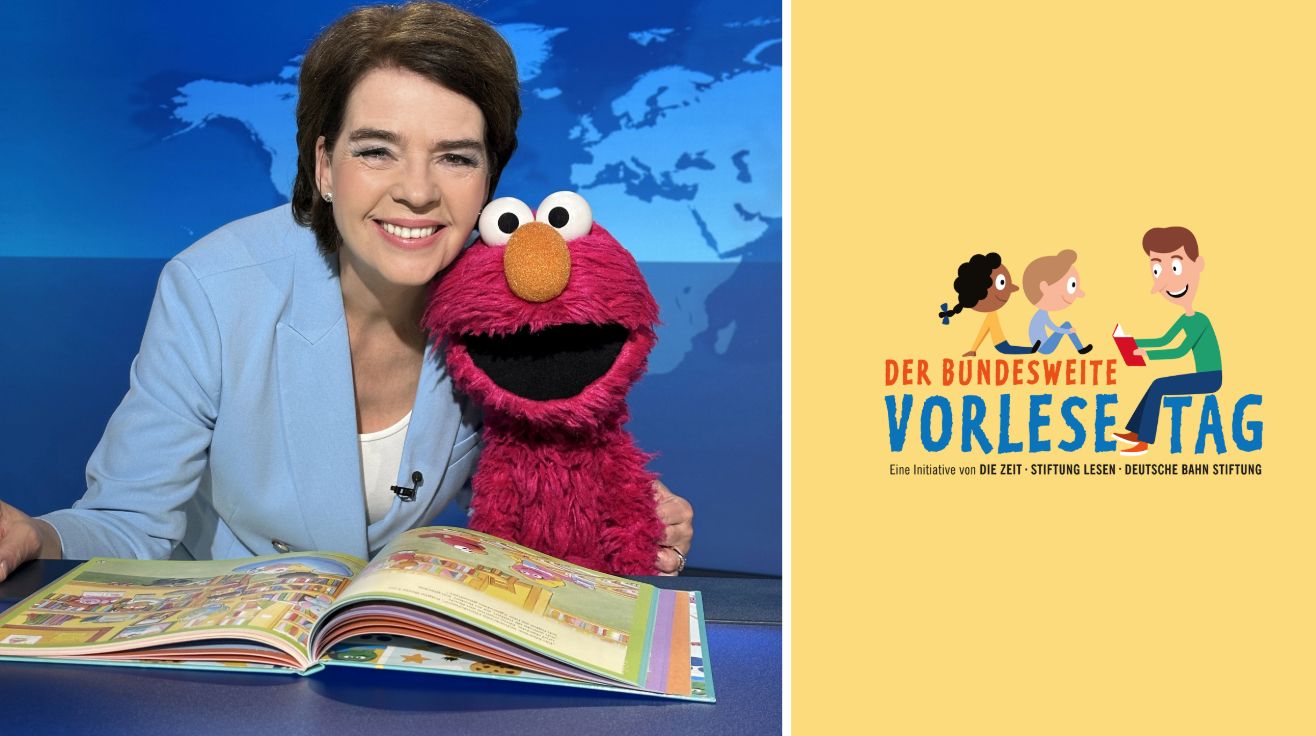 Auf der linken Seite sind Susanne Daubner in hellblauem Blazer und die rote Puppe Elmo zu sehen, die gemeinsam ein aufgeschlagenes Kinderbuch betrachten. Rechts daneben steht auf gelbem Hintergrund das Logo des Bundesweiten Vorlesetags mit einer Illustration von drei Kindern, die gemeinsam lesen.